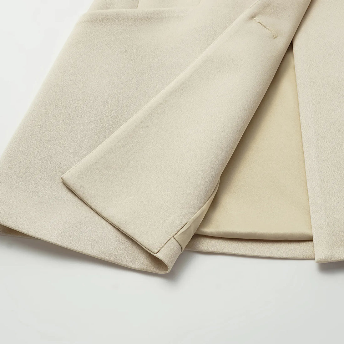"Speak Sleek." Acetate double-breasted blazer—Champagne