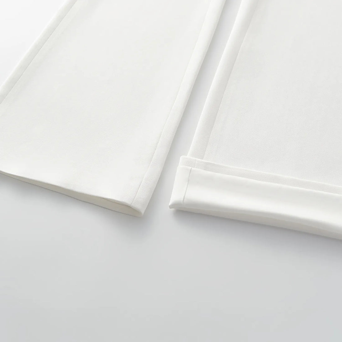 "Speak Sleek." Acetate flared pants—White