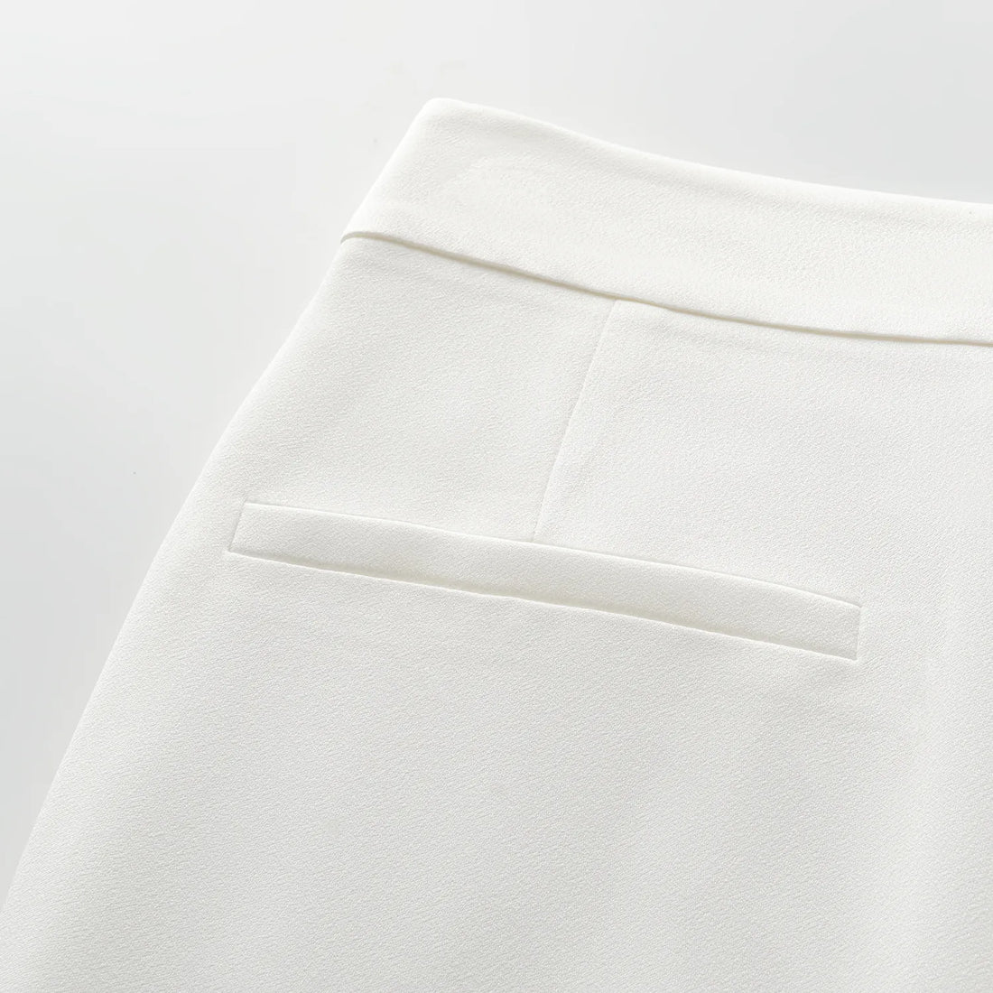 "Speak Sleek." Acetate flared pants—White
