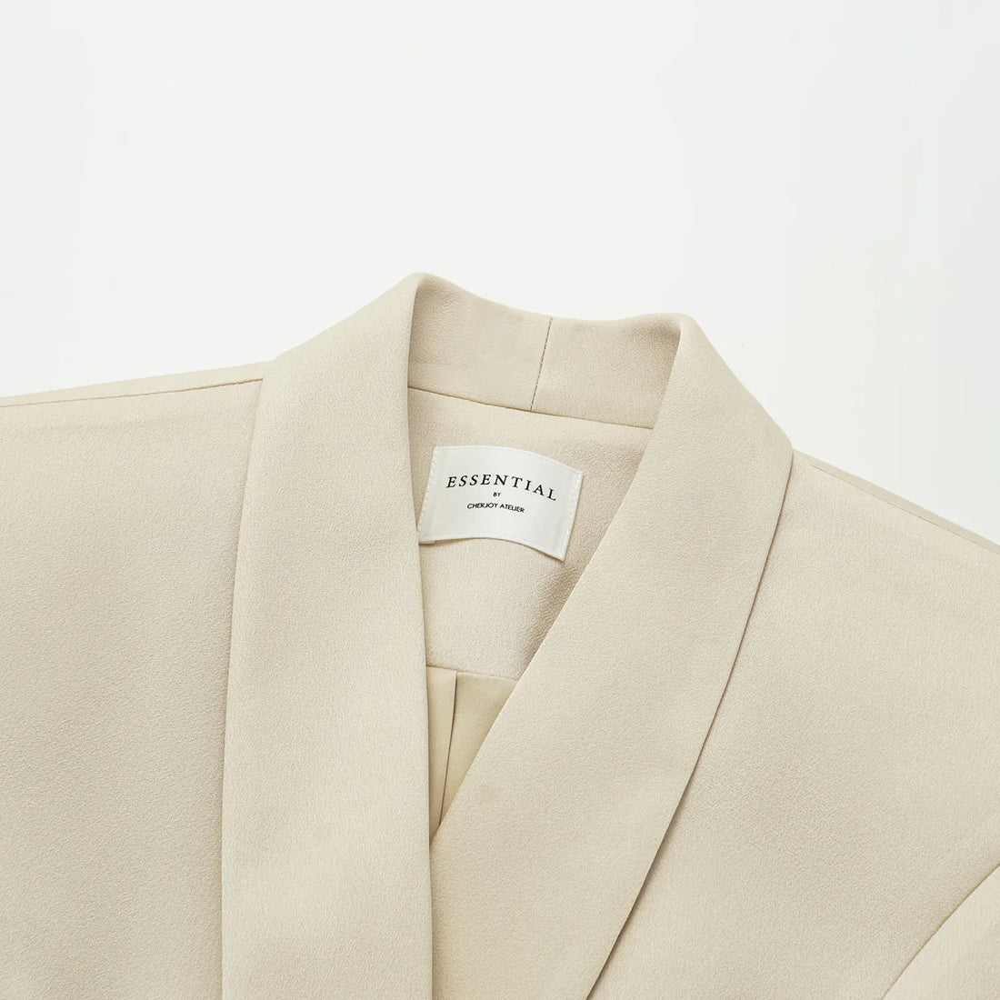 "Speak Sleek." Acetate double-breasted blazer—Champagne