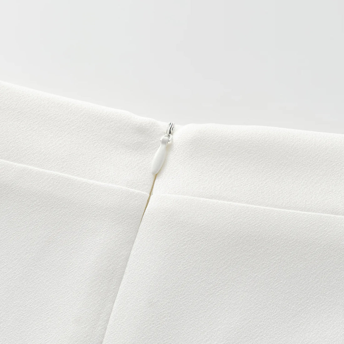 "Speak Sleek." Acetate pencil skirt—White