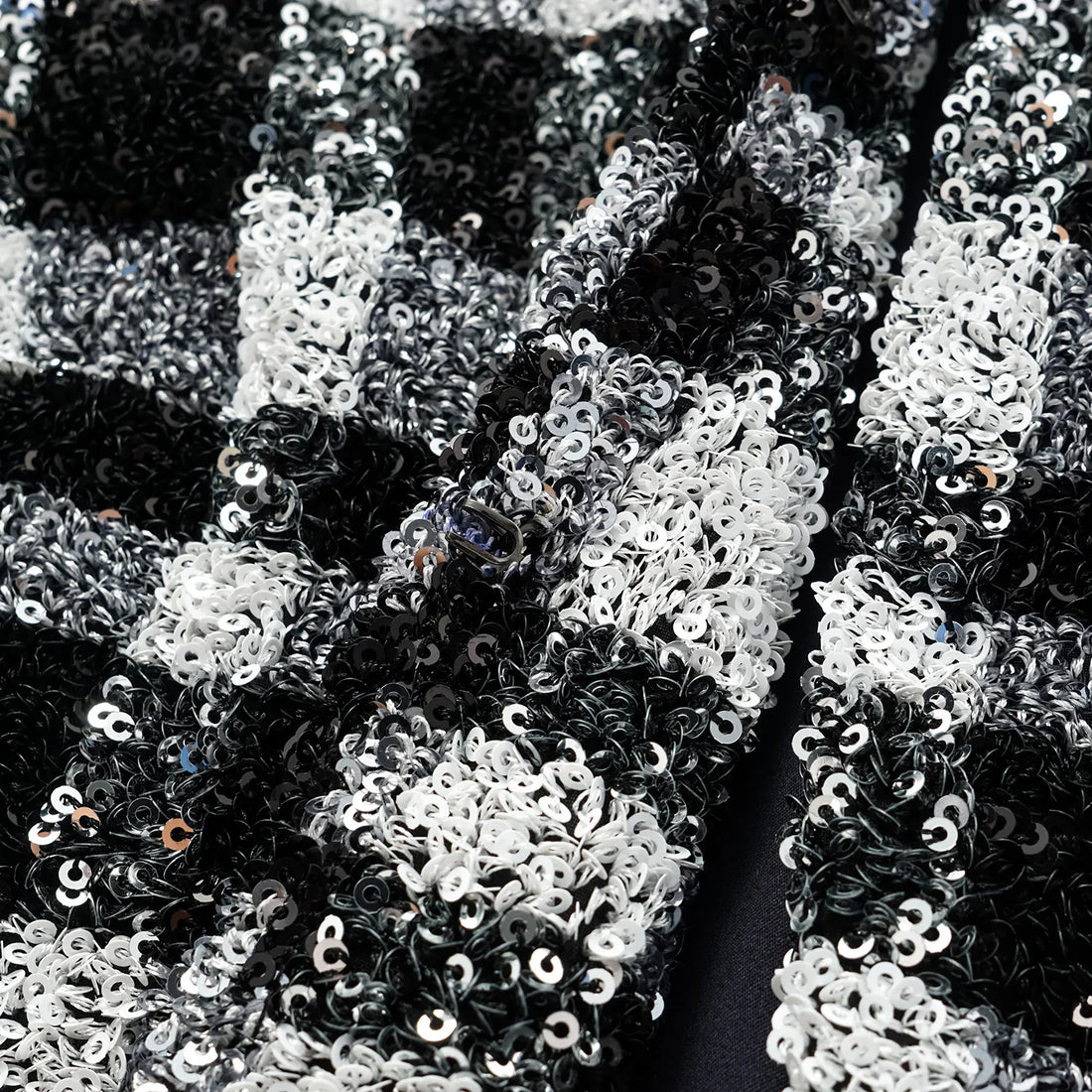 “Welcome to my party.” Sequined shoulder-padded short coat—Classic Checked.