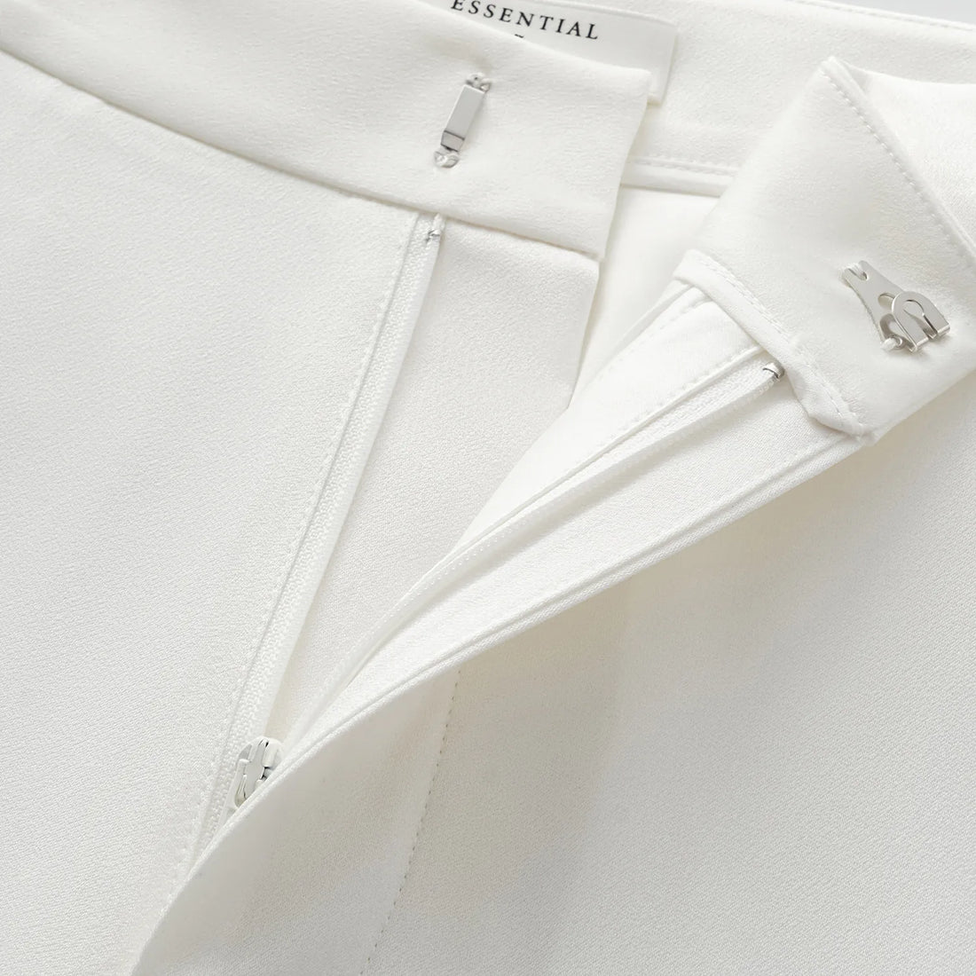 "Speak Sleek." Acetate flared pants—White