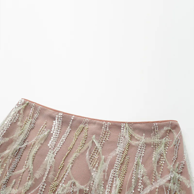 “Welcome to my party.” Beaded feather pencil skirt