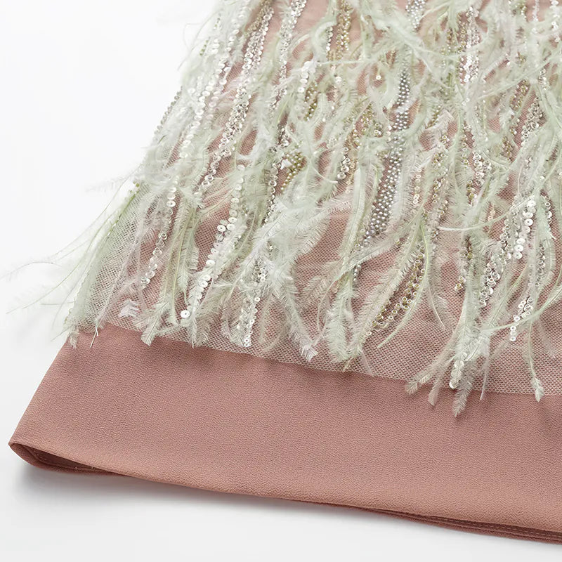 “Welcome to my party.” Beaded feather pencil skirt