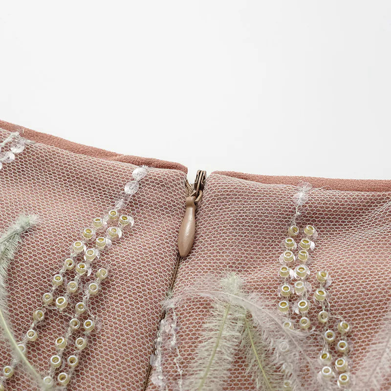 "Welcome to my party." Beaded feather craft shorts