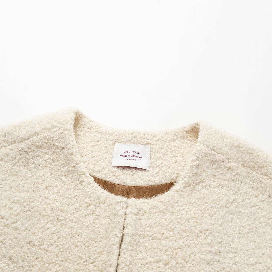 "Tops" alpaca vest