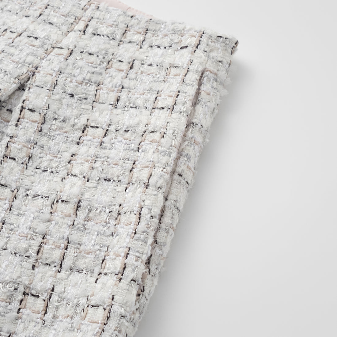 "Chelsea Citywalk." Tweed shorts—Blanc