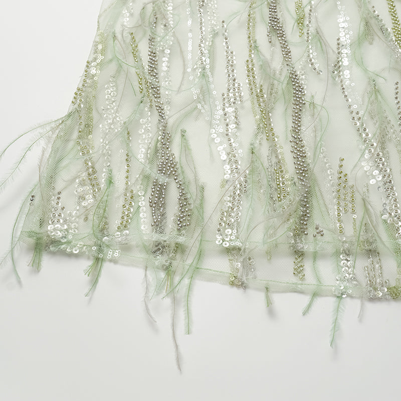 "Welcome to my party." Beaded feather spaghetti strap vest