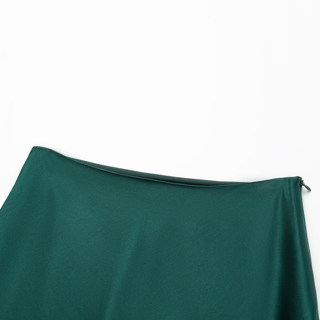 “Daytime sparkle.” Satin draped below-the-knee skirt—Emerald