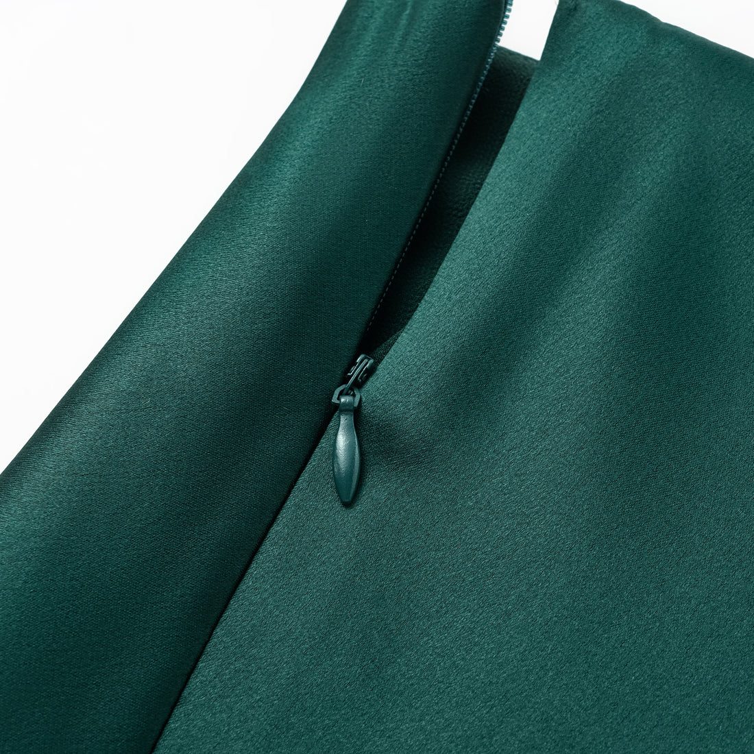“Daytime sparkle.” Satin draped below-the-knee skirt—Emerald