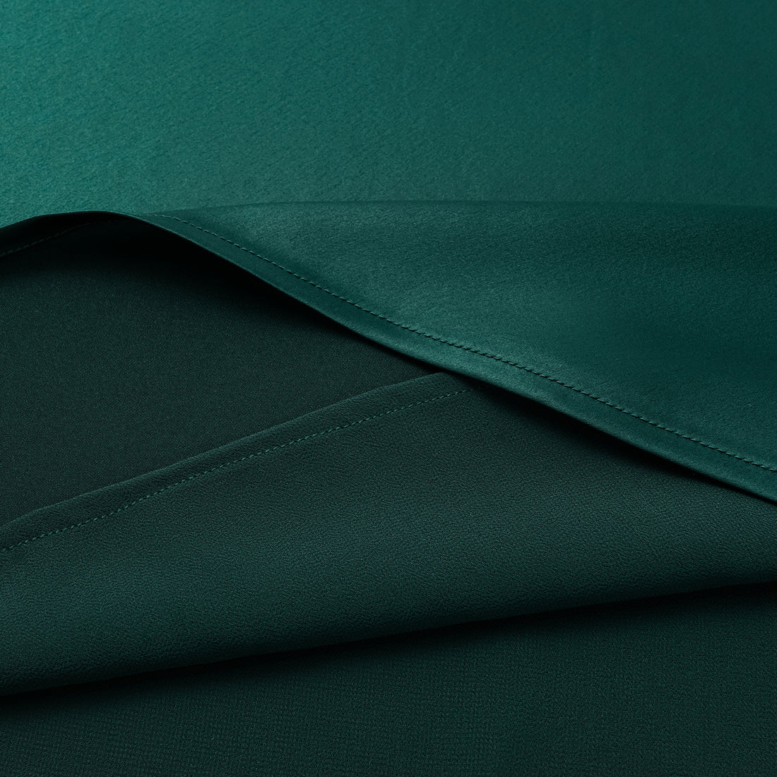 “Daytime sparkle.” Satin draped below-the-knee skirt—Emerald
