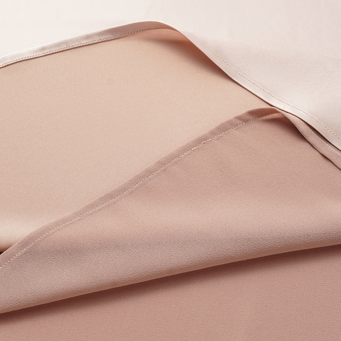 “Daytime sparkle.” Satin draped below-the-knee skirt—nude pink