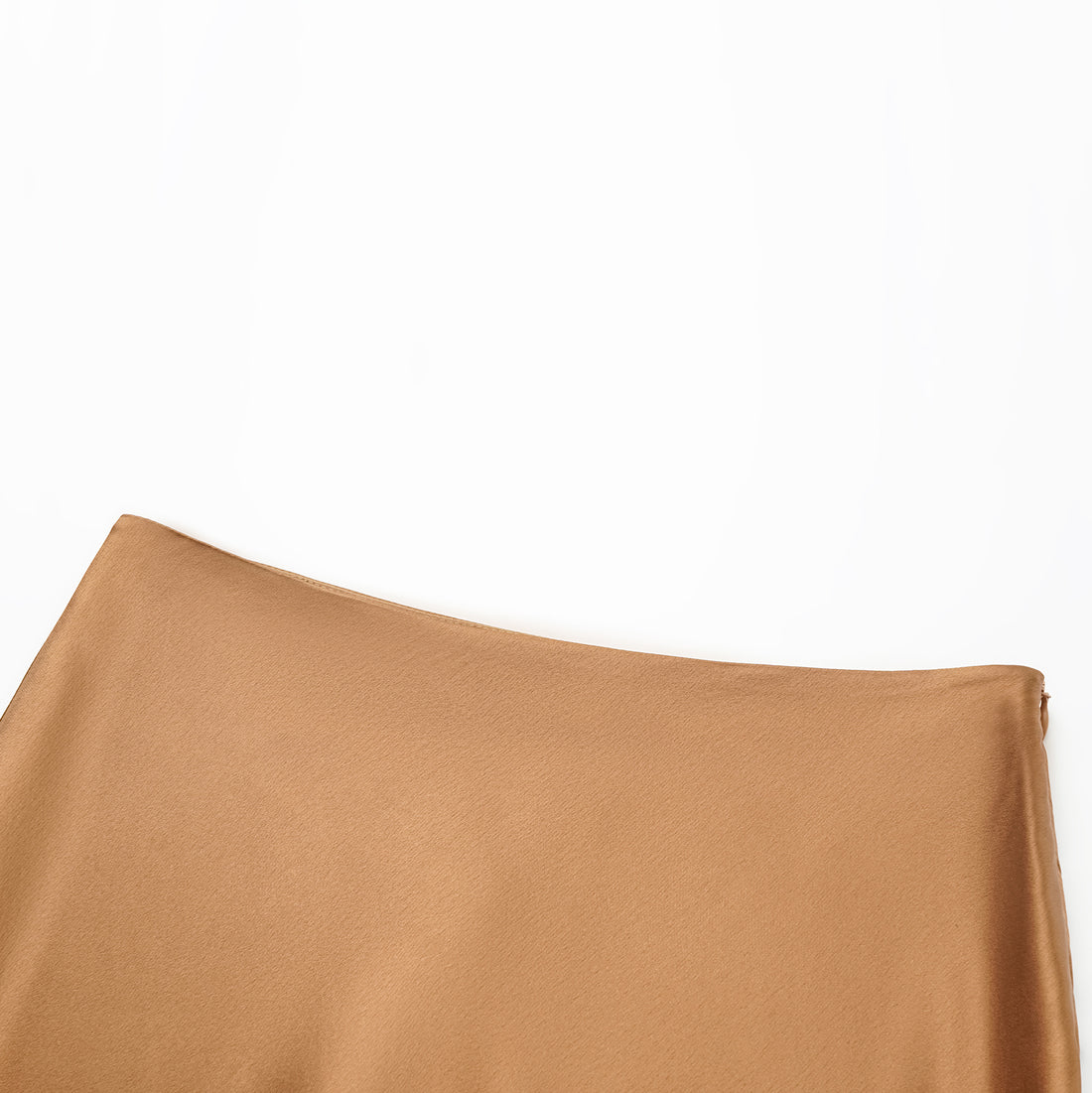“Daytime sparkle.” Satin draped below-the-knee skirt—Caramel gold