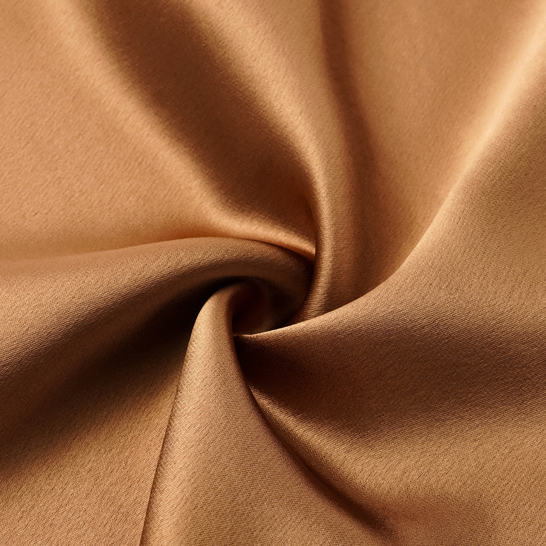“Daytime sparkle.” Satin draped below-the-knee skirt—Caramel gold