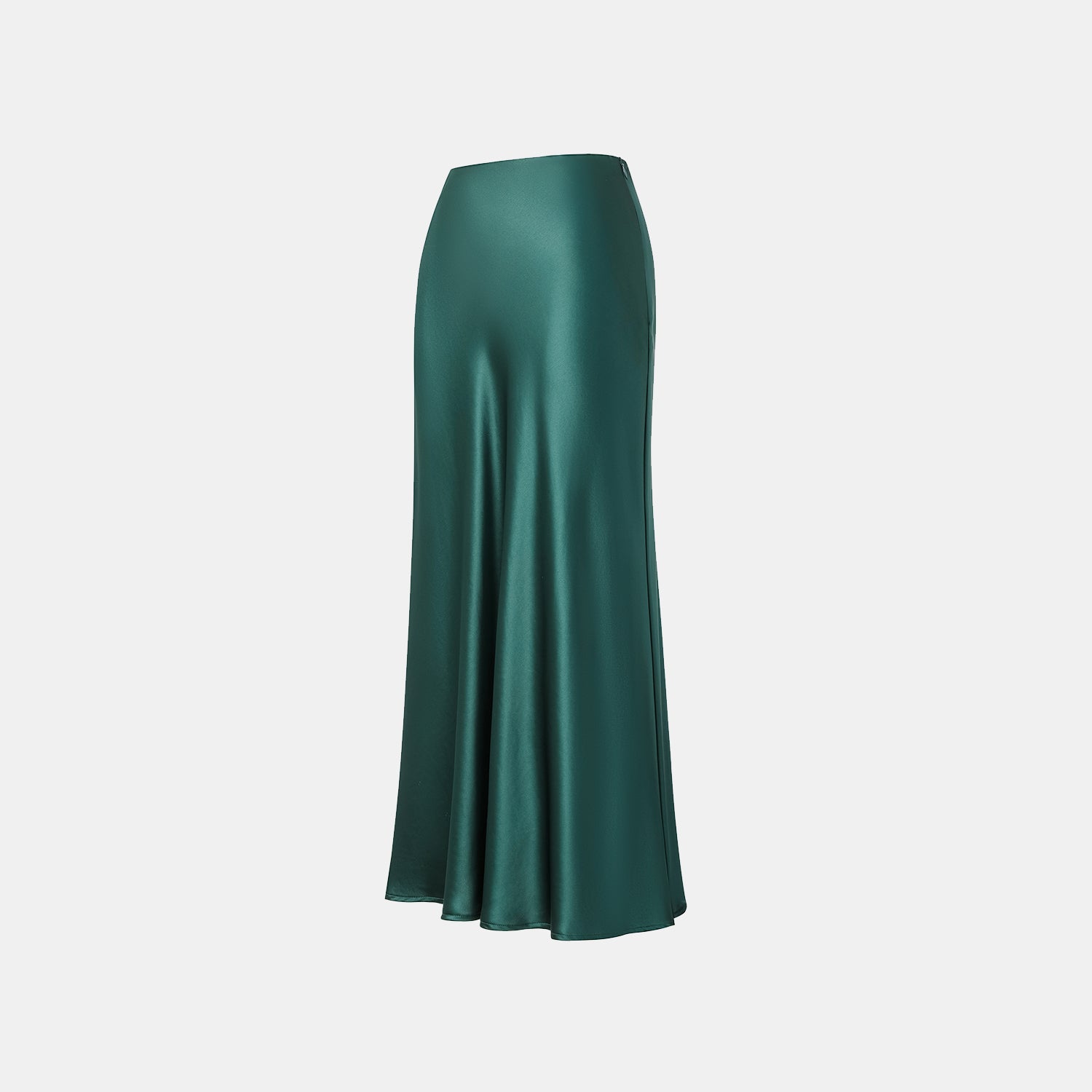 “Daytime sparkle.” 緞面垂墜膝下裙—祖母綠
