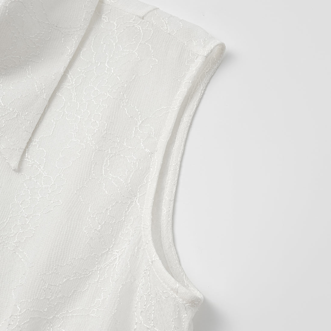 "Daytime Sparkle." Sleeveless shirt with French premium laminated lace