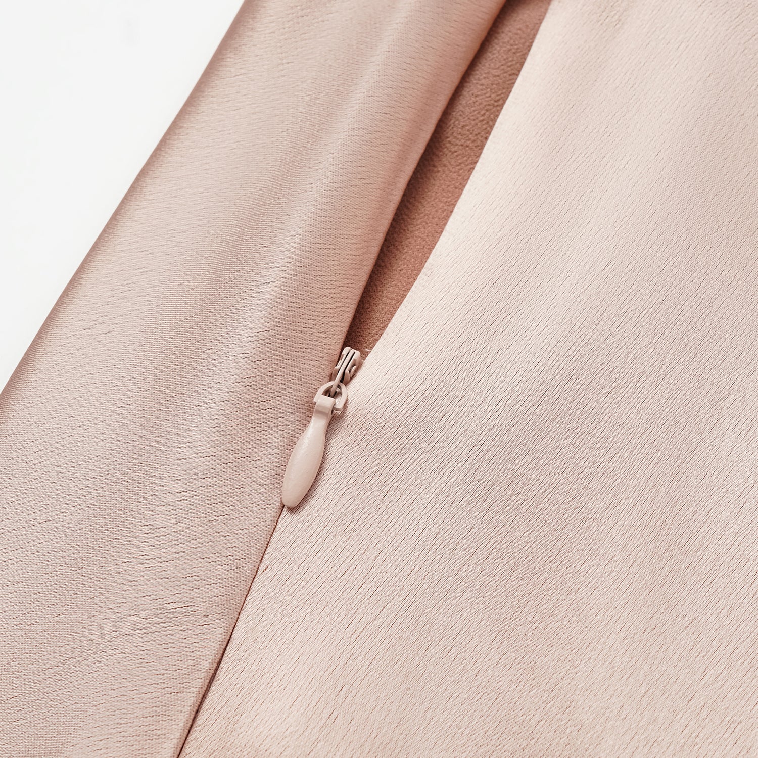 “Daytime sparkle.” Satin draped below-the-knee skirt—nude pink 